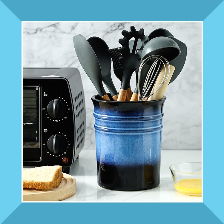 stainless steel and blue ceramic kitchen utensil holders